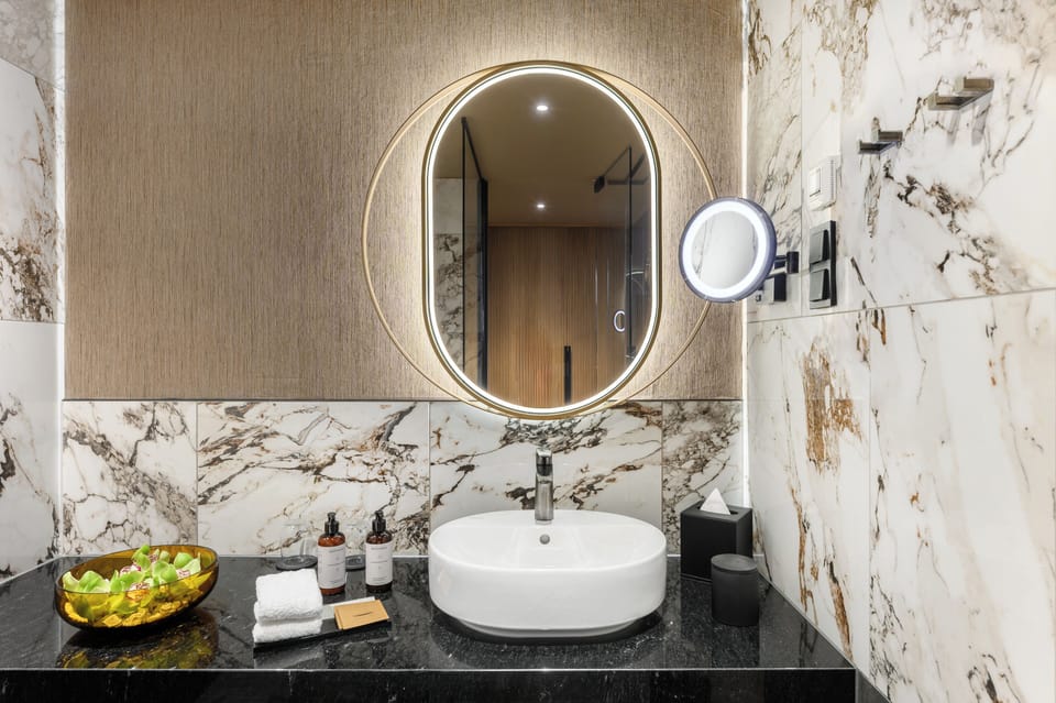 Premium Double Room, Balcony, City View | Bathroom | Hair dryer, slippers, towels, soap