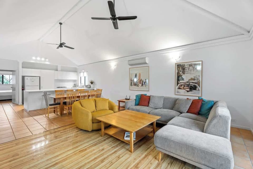 Spacious open-plan living with vaulted ceilings, a fully equipped kitchen, and stylish lounge area. Relax in comfort with air-conditioning, ceiling fans, and cosy seatings!