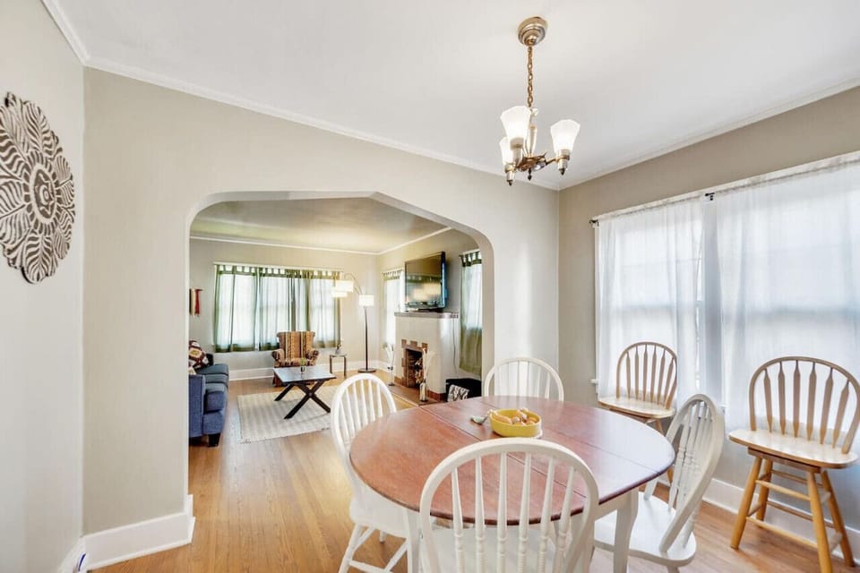 Bright dining area with views of both the kitchen and living room.