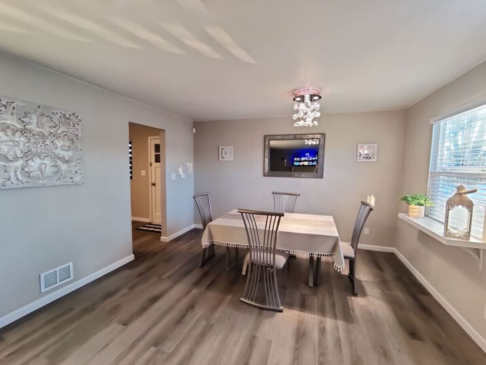 This bright dining area is right off of the kitchen to sit and enjoy your perfect meals or even play board games.