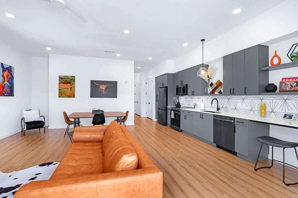 Condo, 1 King Bed with Sofa bed, Patio, City View (Pure Texas Poolside Oasis) | Living area | 50-inch flat-screen TV with digital channels