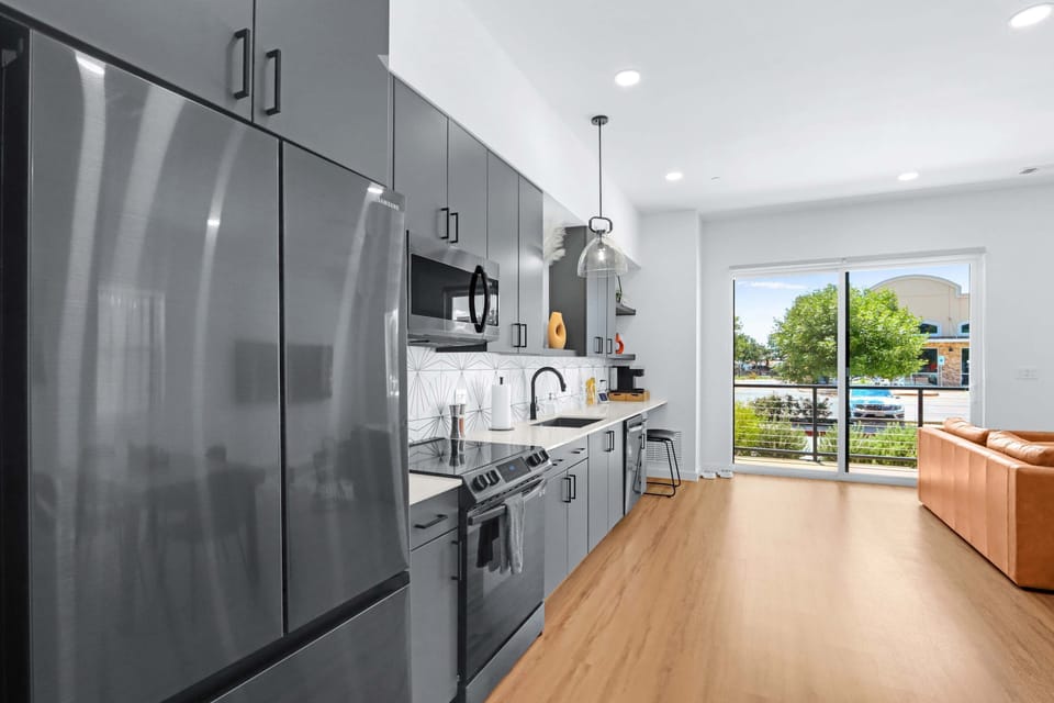 Condo, 1 King Bed with Sofa bed, Patio, City View (Pure Texas Poolside Oasis) | Private kitchen | Fridge, microwave, oven, stovetop
