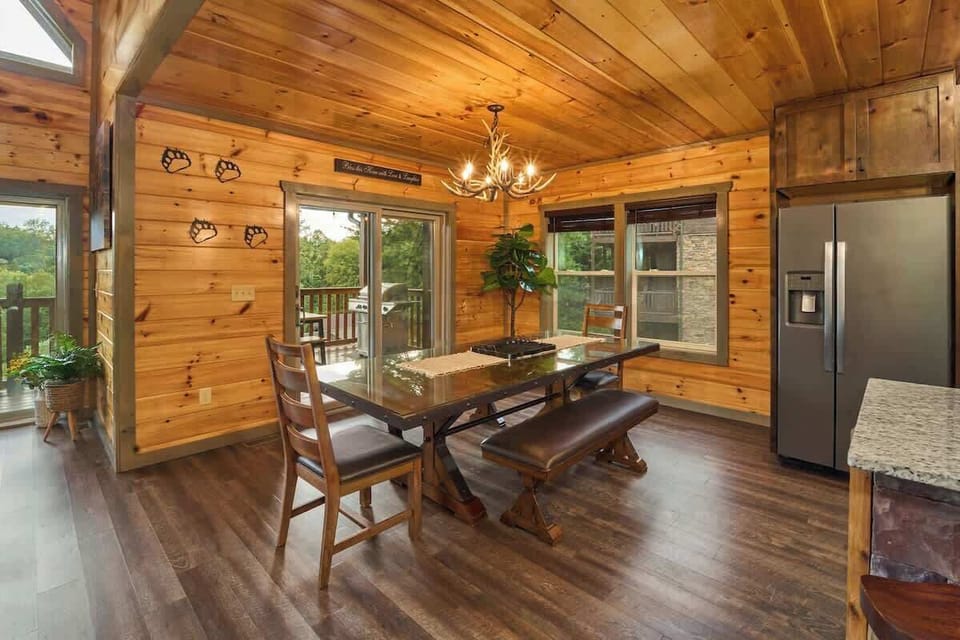 Gather around the spacious dining table for 8, with additional seating for 6 at the kitchen island. Perfect for family meals and group gatherings, this inviting space combines rustic charm with comfort, creating the ideal setting for shared moments!