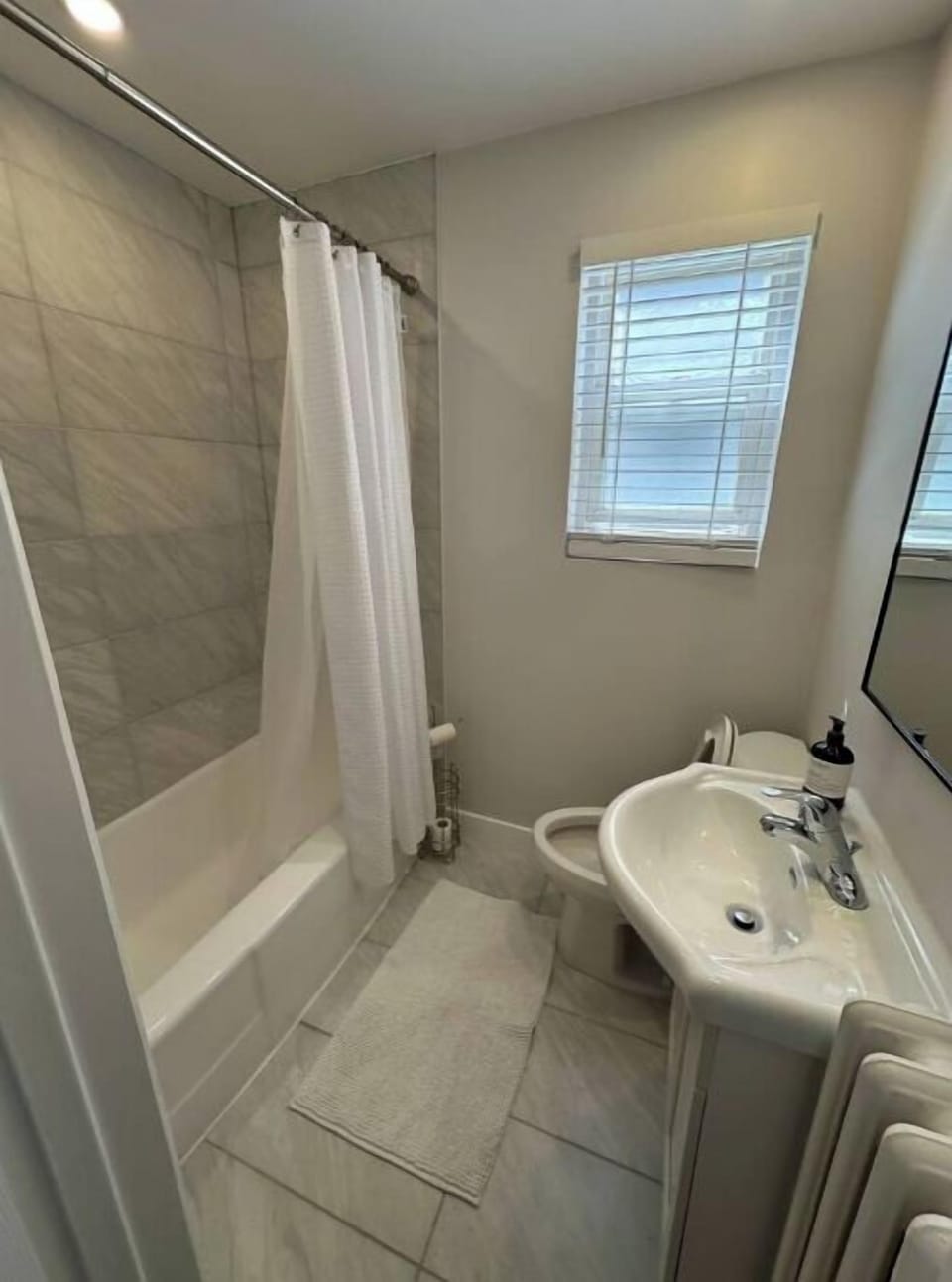 Full bathroom with bathtub/shower.