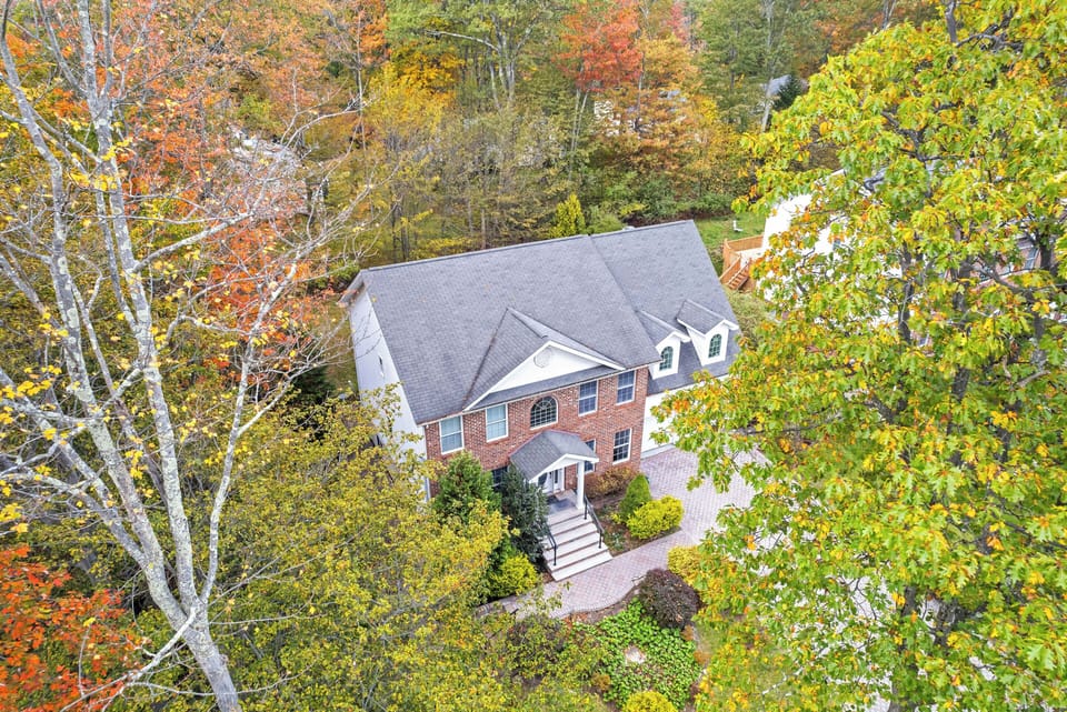 Surrounded by trees, offering privacy and nature views.
