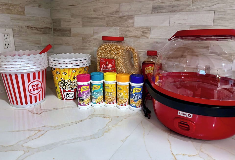 Settle in for the ultimate cozy movie night: the provided popcorn maker pops fresh popcorn in minutes (kernels, oil & seasonings included) + our private Plex library with tons of classics, new hits, and family-friendly picks.