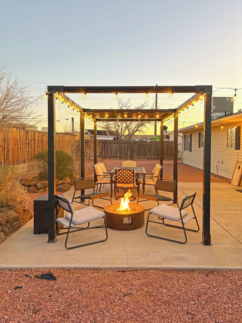 Outdoor space with a fire pit, grill & dining area!