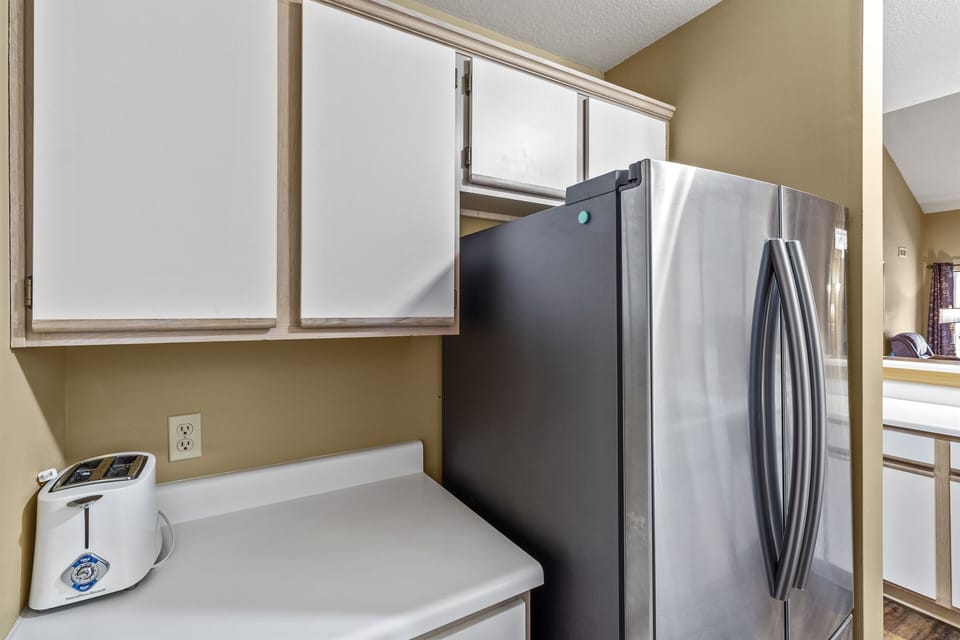 Electric dishwasher, stove, microwave, full-size refrigerator, & all dishes.