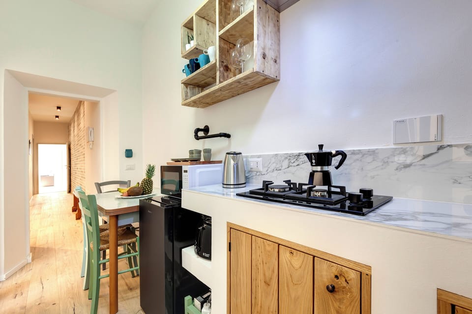 Apartment | Private kitchenette | Full-size fridge, microwave, stovetop, coffee/tea maker