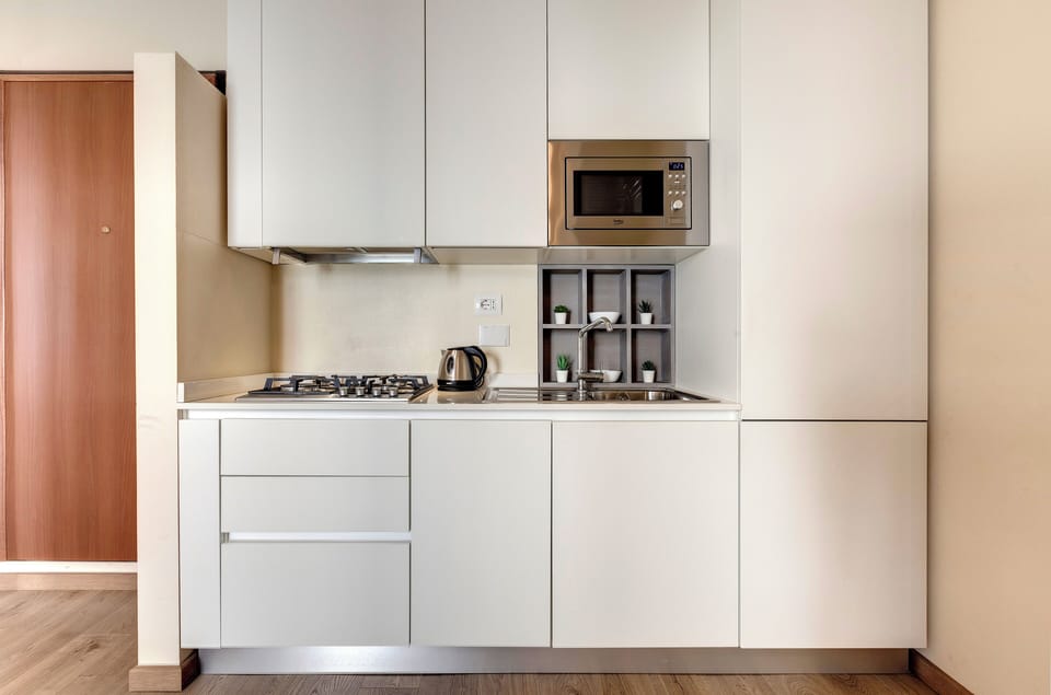 Apartment | Private kitchenette | Full-size fridge, microwave, stovetop, dishwasher
