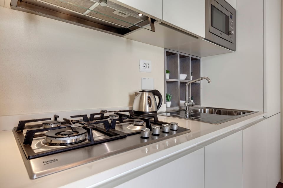 Apartment | Private kitchenette | Full-size fridge, microwave, stovetop, dishwasher