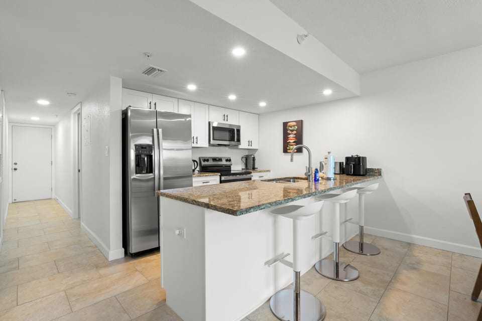 Deluxe Apartment, 2 Bedrooms | Private kitchen | Full-size fridge, microwave, oven, dishwasher