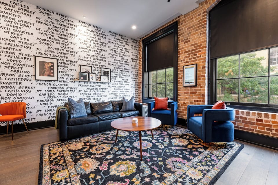 Relax in the living area with a smart TV, stylish seating, and a sleeper sofa for extra guests. Perfect for families or group stays in New Orleans, this inviting space is ideal for movie nights or recharging after a day in the city.