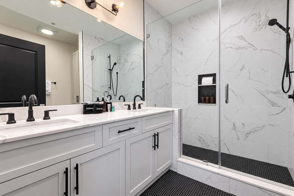 Retreat to the Primary bedroom with a plush king bed, walk-in closet, blackout shades, and a smart TV. Designed for comfort and privacy, this suite is perfect for recharging after a day exploring New Orleans.