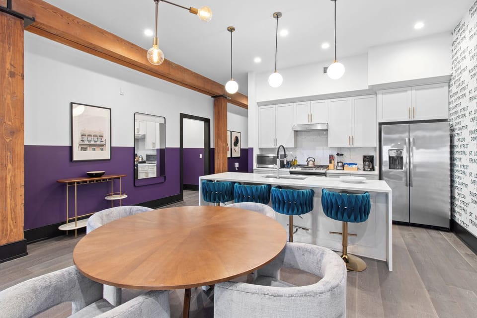 Enjoy meals together at your in-suite dining table with seating for your group. Whether it's takeout, delivery, or a home-cooked meal, this cozy dining area makes every stay at 888 Baronne feel like home in New Orleans.