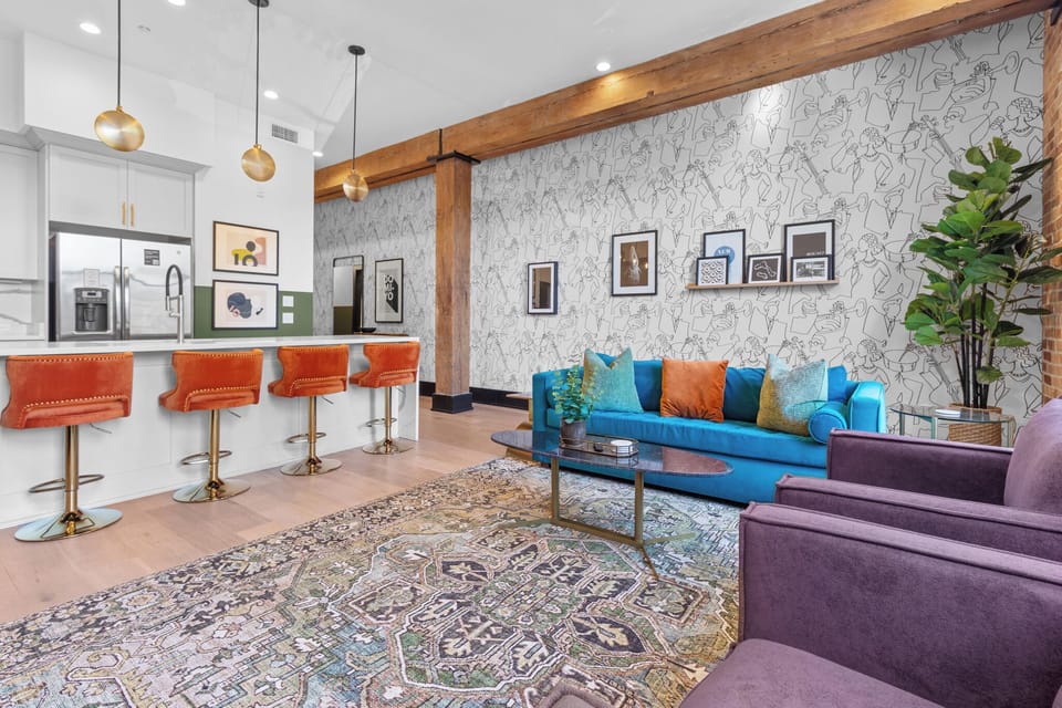 Relax in the living area with a smart TV, stylish seating and a sleeper sofa for extra guests. Perfect for families or group stays in New Orleans, this inviting space is ideal for movie nights or recharging after a day in the city.