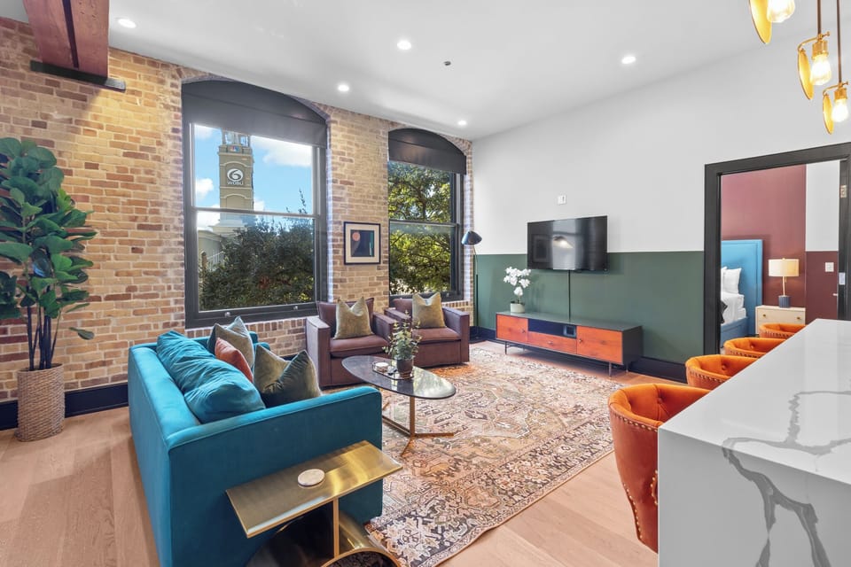 Relax in the living area with a smart TV, stylish seating and a sleeper sofa for extra guests. Perfect for families or group stays in New Orleans, this inviting space is ideal for movie nights or recharging after a day in the city.