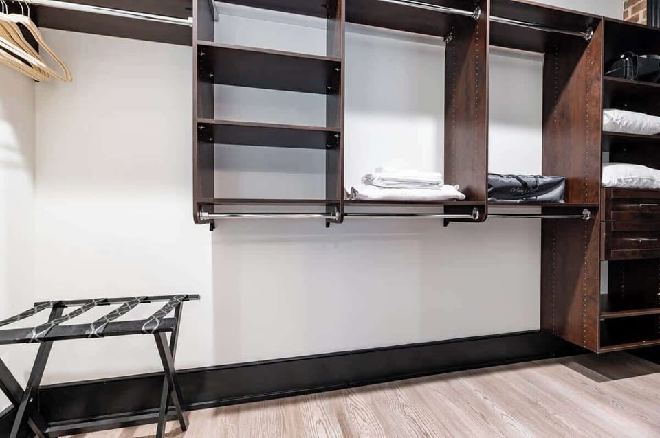 Retreat to the Primary bedroom with a plush king bed, walk-in closet, blackout shades, and a smart TV. Designed for comfort and privacy, this suite is perfect for recharging after a day exploring New Orleans.