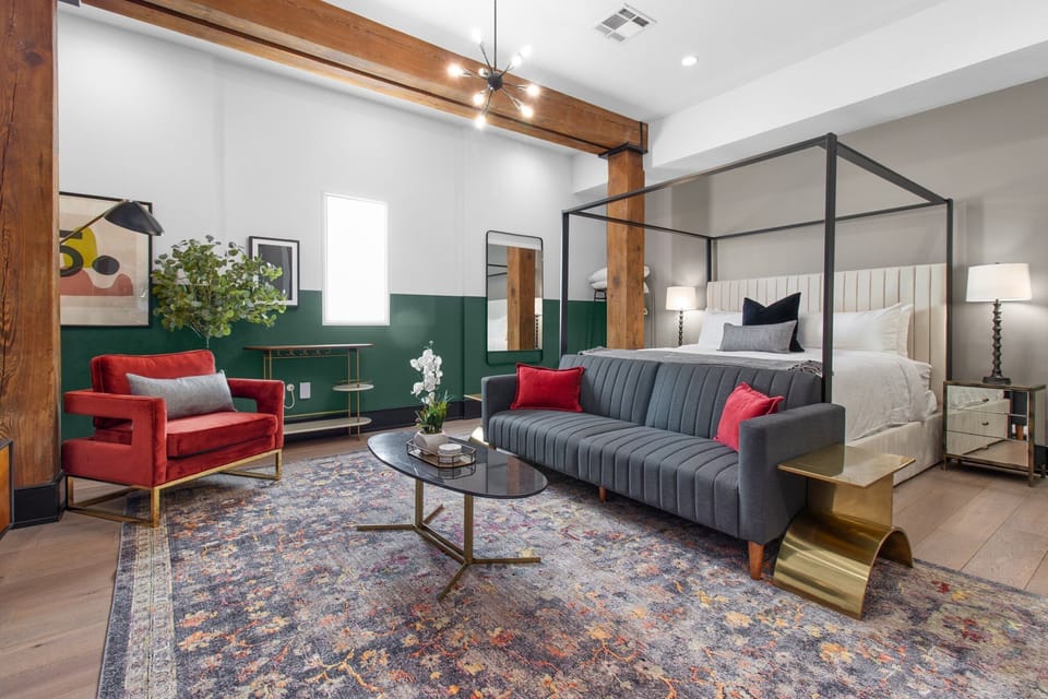 Relax in the studio living area with a smart TV, stylish seating, king-sized bed and a futon for extra guest. This inviting space is ideal for movie nights or recharging after a day in the city.