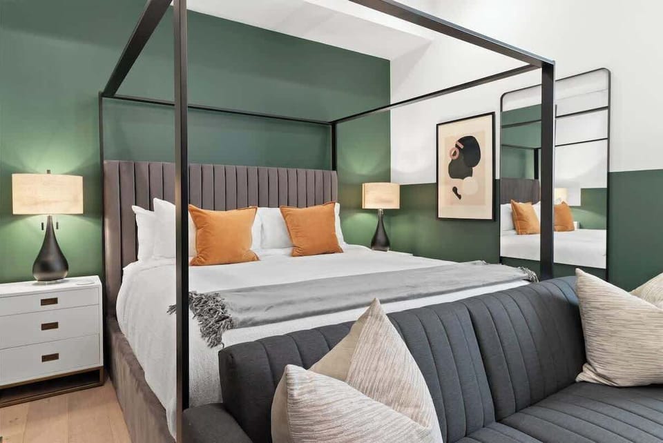 Relax in the studio living area with a smart TV, stylish seating, king-sized bed and a futon for extra guest. This inviting space is ideal for movie nights or recharging after a day in the city.