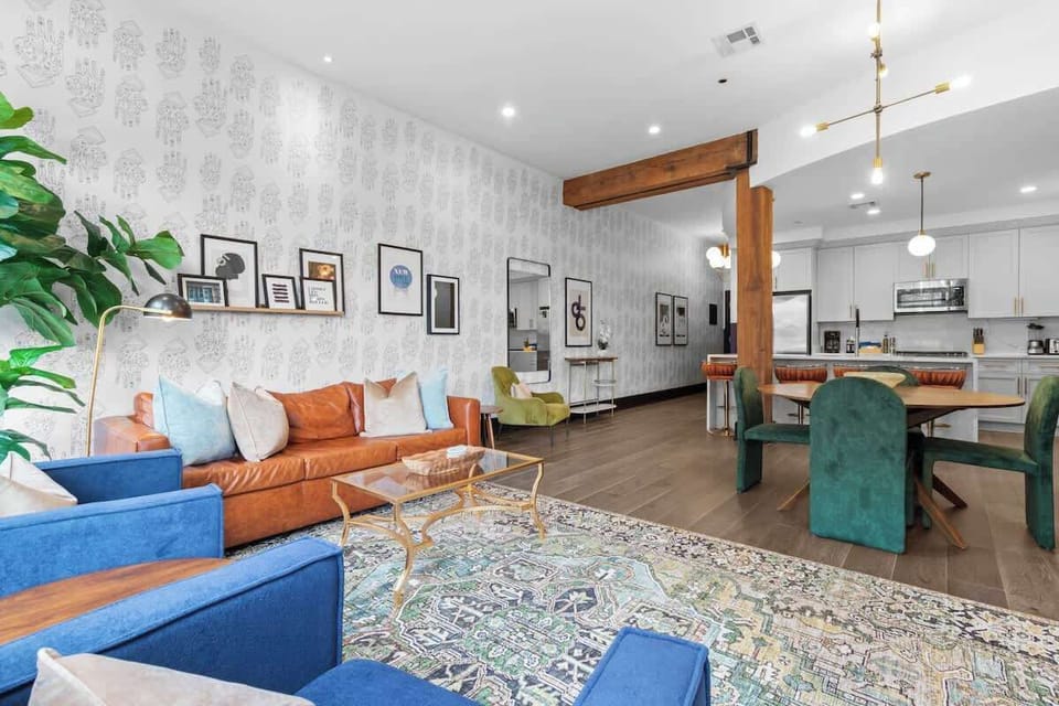 Relax in the living area with a smart TV, stylish seating, and a sleeper sofa for extra guests. Perfect for families or group stays in New Orleans, this inviting space is ideal for movie nights or recharging after a day in the city.