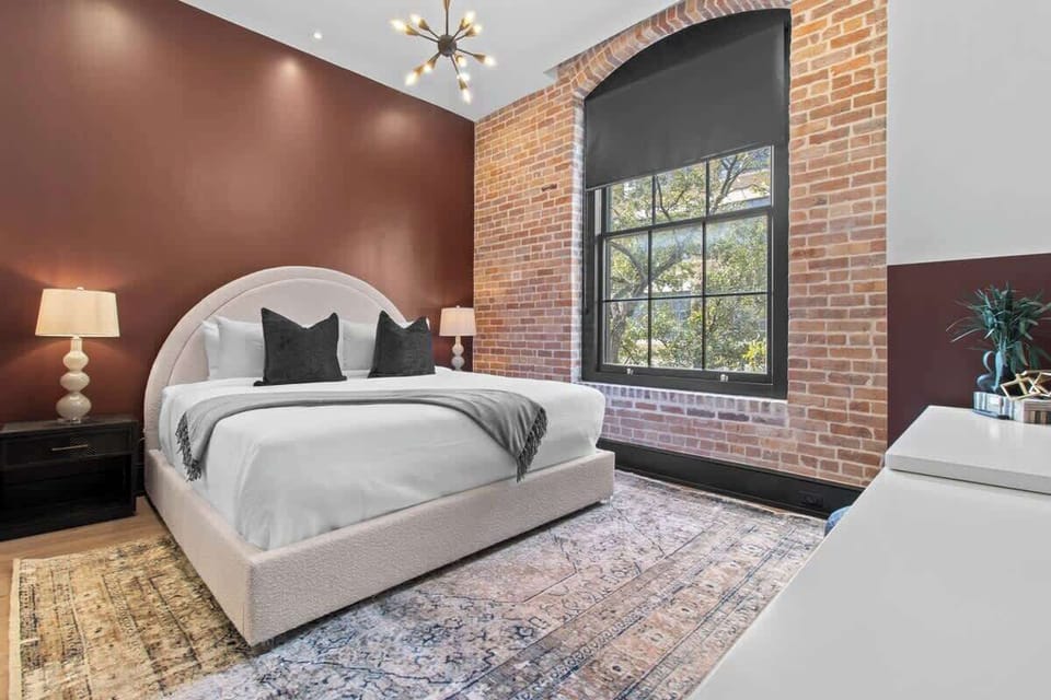 Retreat to the Primary bedroom with a plush king bed, walk-in closet, blackout shades, and a smart TV. Designed for comfort and privacy, this suite is perfect for recharging after a day exploring New Orleans.
