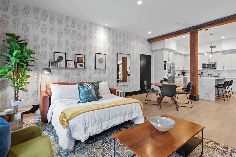 Relax in the living area with a smart TV, stylish seating, and a sleeper sofa for extra guests. Perfect for families or group stays in New Orleans, this inviting space is ideal for movie nights or recharging after a day in the city.