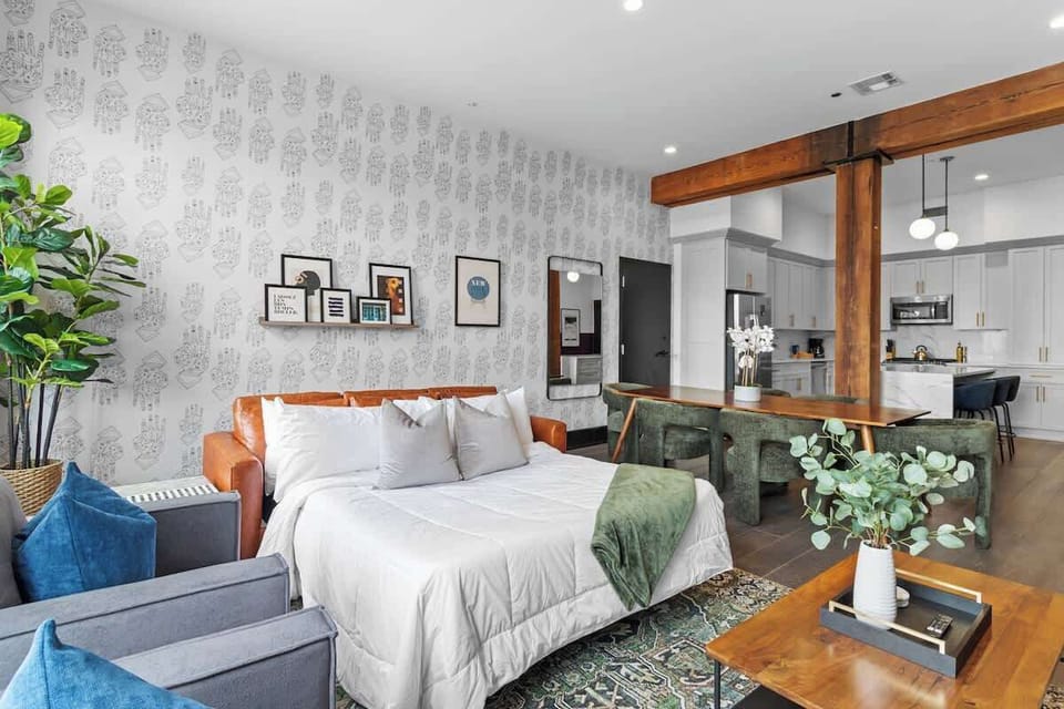 Relax in the living area with a smart TV, stylish seating, and a sleeper sofa for extra guests. Perfect for families or group stays in New Orleans, this inviting space is ideal for movie nights or recharging after a day in the city.