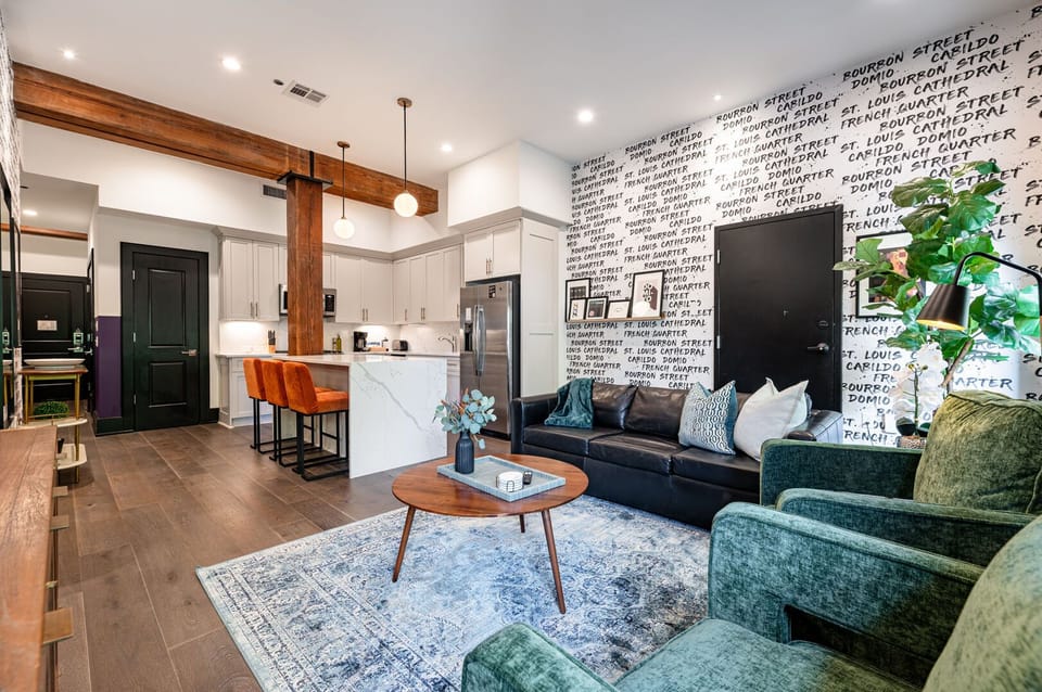 Relax in the living area with a smart TV, stylish seating, and a sleeper sofa for extra guests. Perfect for families or group stays in New Orleans, this inviting space is ideal for movie nights or recharging after a day in the city.