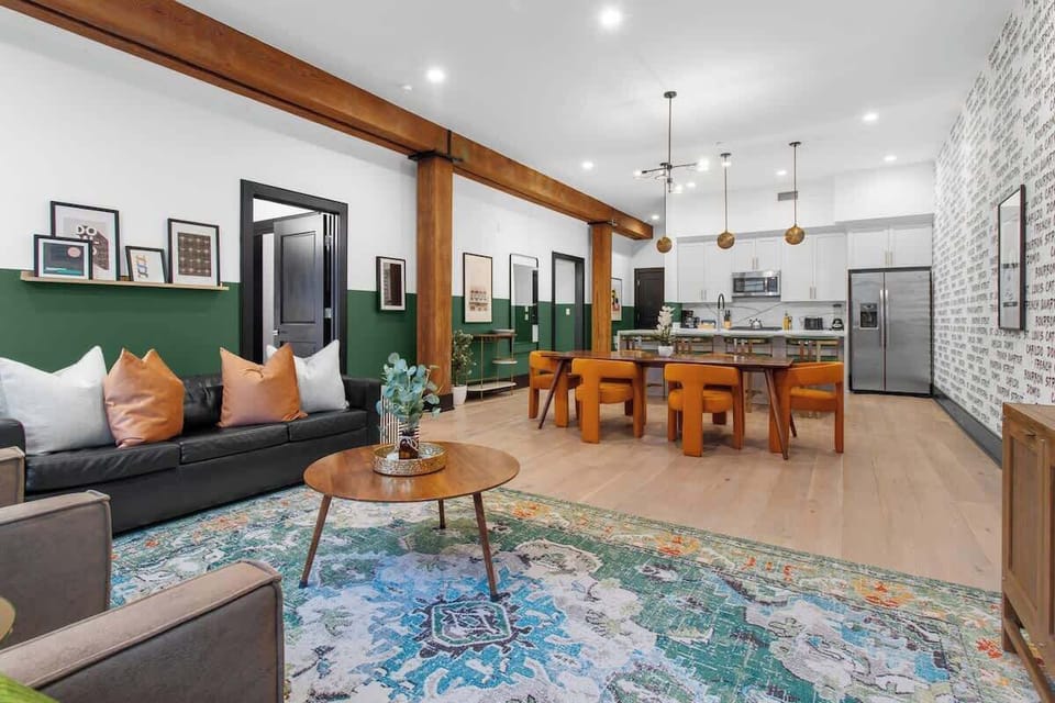 Relax in the living area with a smart TV, stylish seating, and a queen-size sleeper sofa for extra guests. Perfect for families or group stays in New Orleans, this inviting space is ideal for movie nights or recharging after a day in the city.