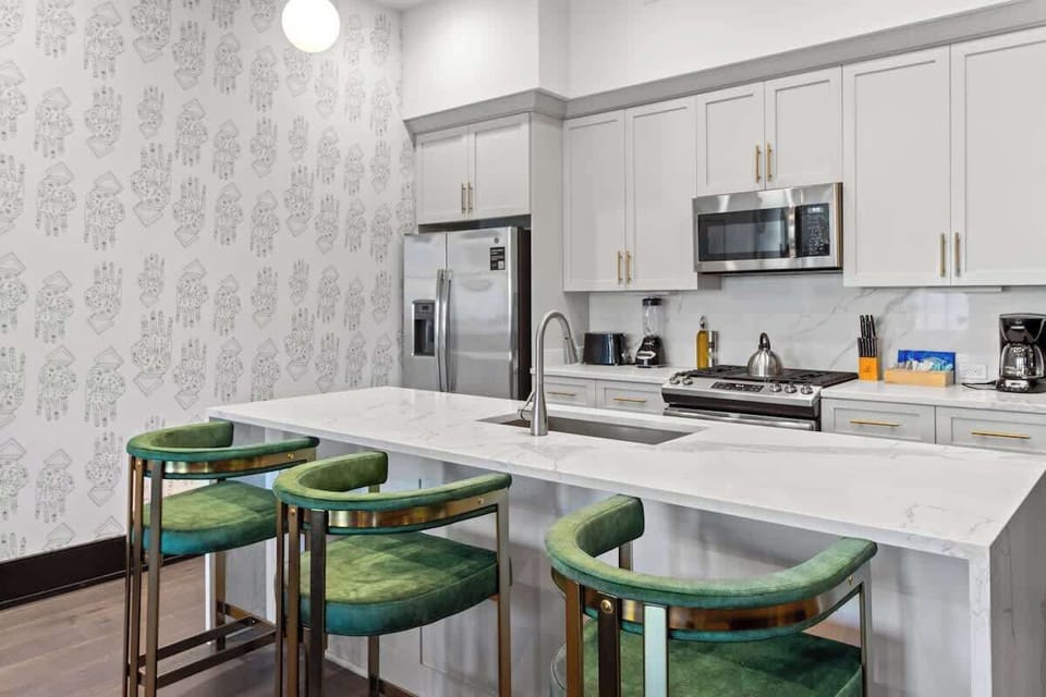 This property features 2 connecting living areas with 2 separate dining areas and kitchens equipped with a Dishwasher, Gas Stove and Microwave