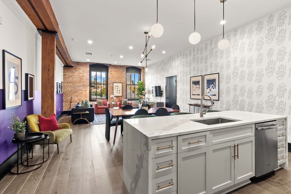 This property features 2 connecting living areas with 2 separate dining areas and kitchens equipped with a Dishwasher, Gas Stove and Microwave