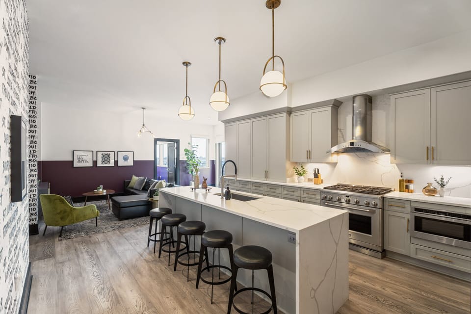 Cook or snack in style with a full kitchen featuring GE stainless appliances, cookware, and an island with bar seating. Ideal for short or extended stays, our kitchens make group travel in New Orleans easy and comfortable.