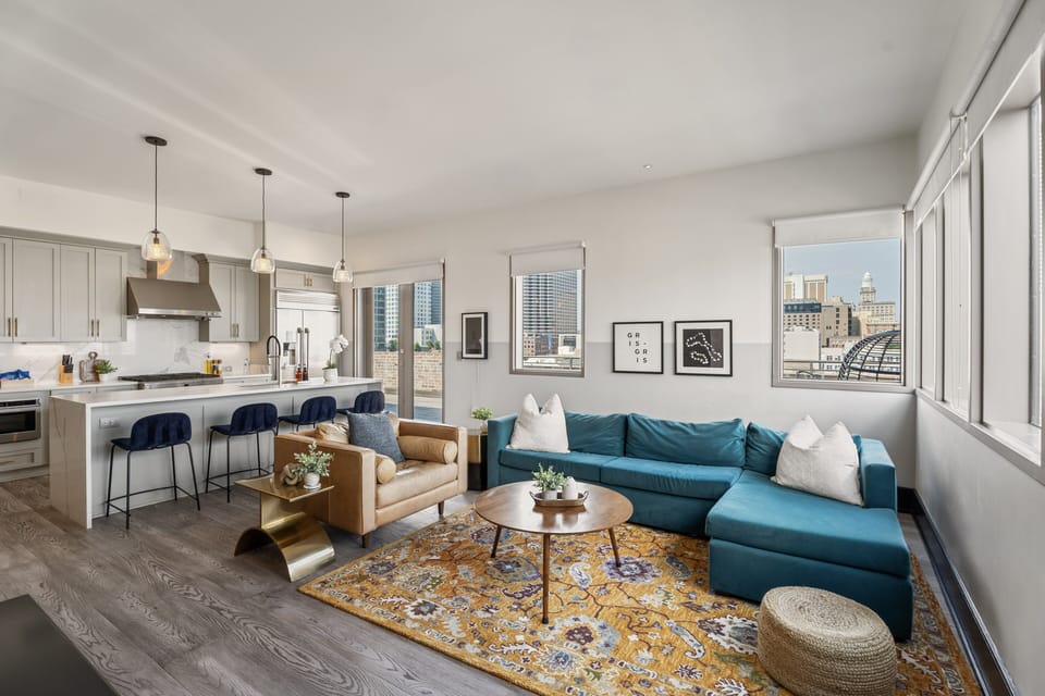 Relax in the living area with a smart TV, stylish seating, and a sleeper sofa for extra guests. Perfect for families or group stays in New Orleans, this inviting space is ideal for movie nights or recharging after a day in the city.