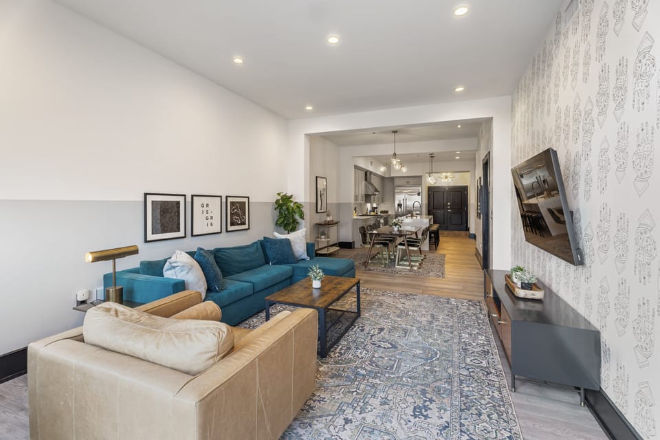Relax in the living area with a smart TV, stylish seating, and a sleeper sofa for extra guests. Perfect for families or group stays in New Orleans, this inviting space is ideal for movie nights or recharging after a day in the city.