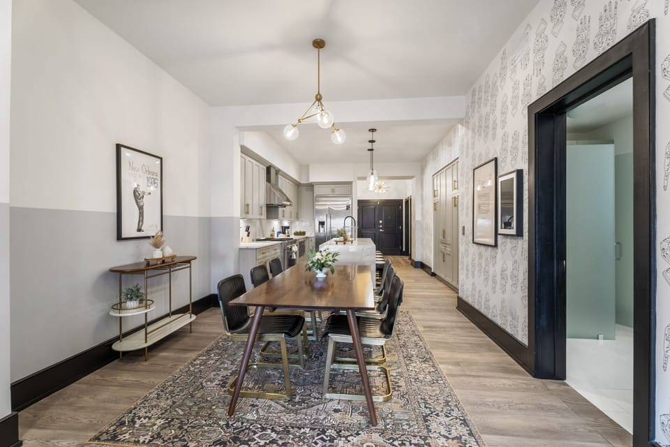 Enjoy meals together at your in-suite dining table with seating for your group. Whether it's takeout, delivery, or a home-cooked meal, this cozy dining area makes every stay at 888 Baronne feel like home in New Orleans.