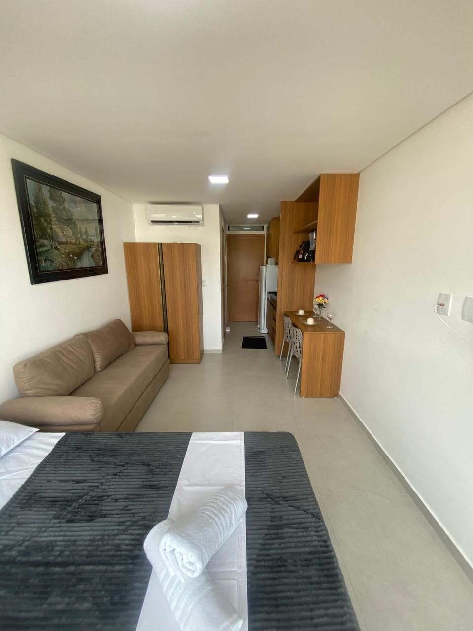 Classic Studio, City View | Living area | Flat-screen TV