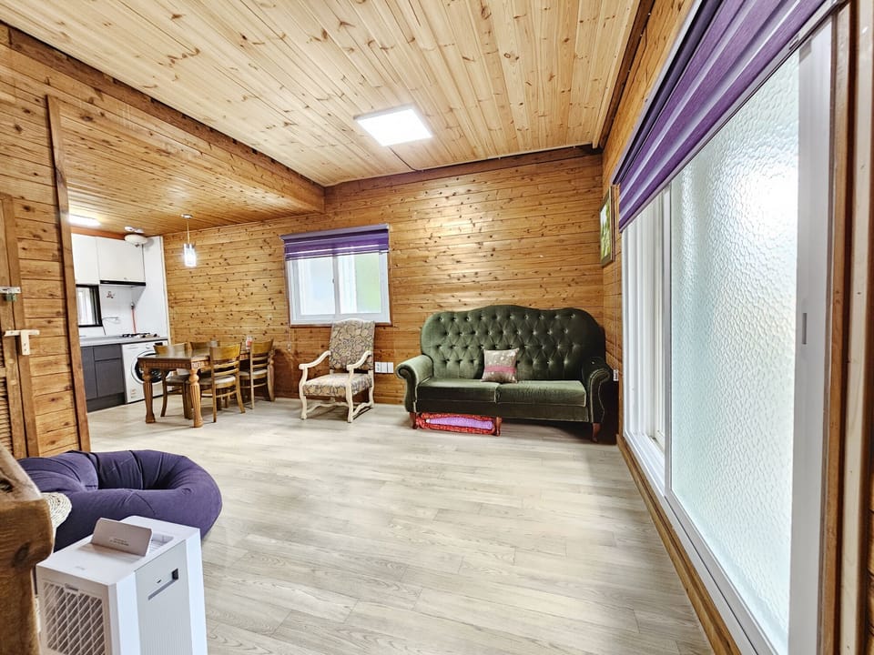 Duplex | Living area | 32-inch flat-screen TV with cable channels