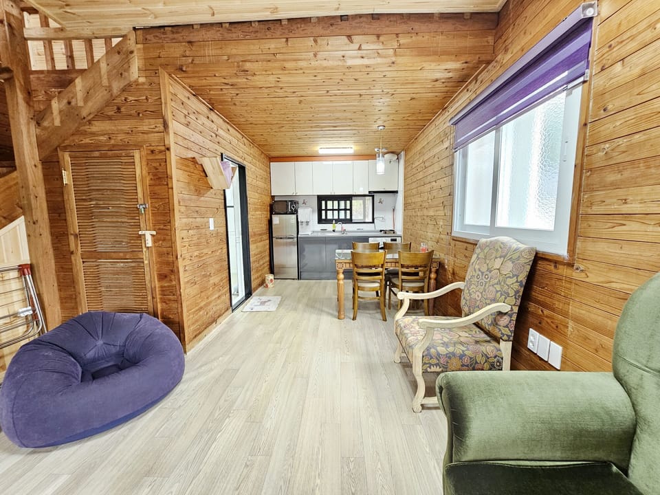 Duplex | Living area | 32-inch flat-screen TV with cable channels