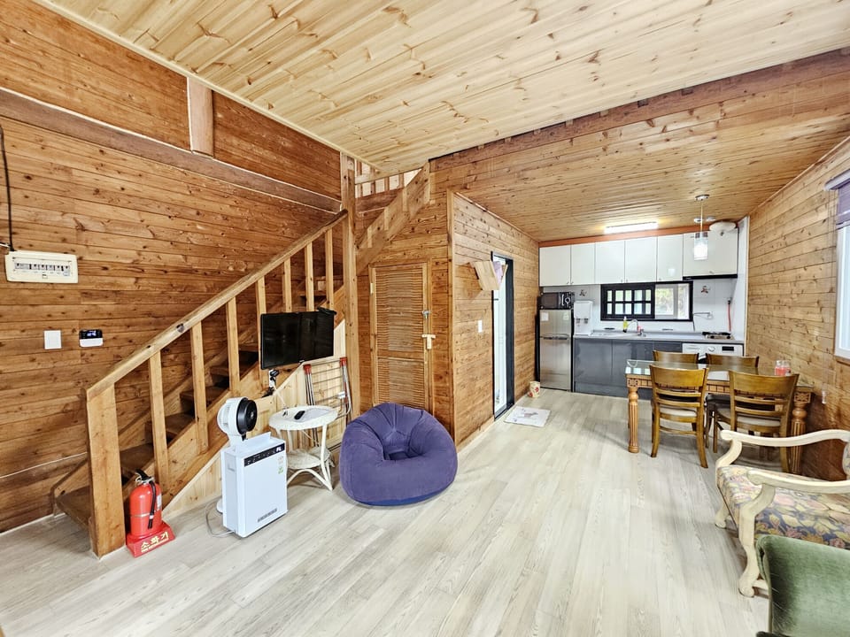 Duplex | Living area | 32-inch flat-screen TV with cable channels