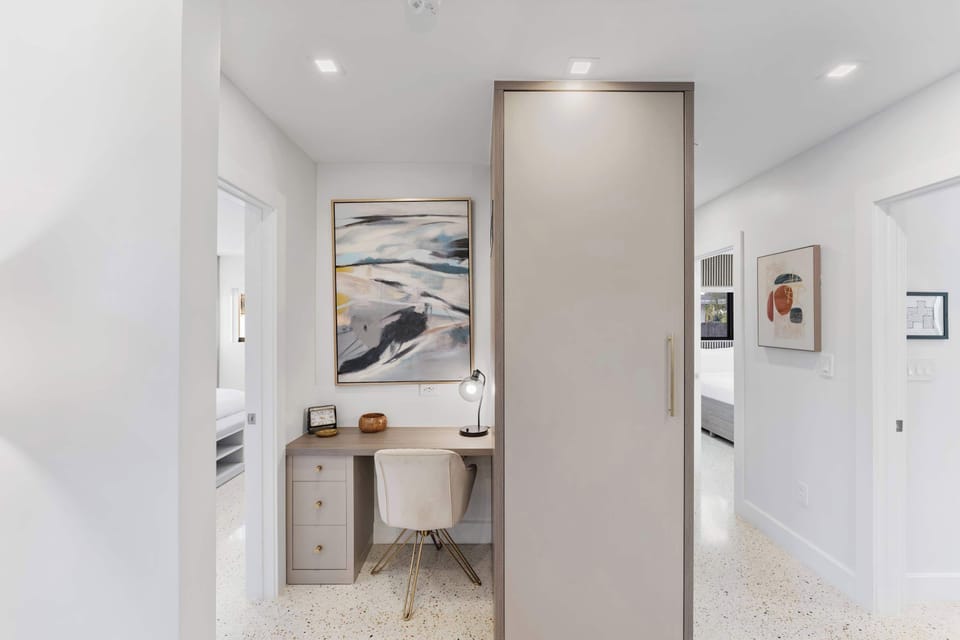 Need to catch up on work? A dedicated workspace just outside the bedroom offers a quiet, comfortable spot to focus.