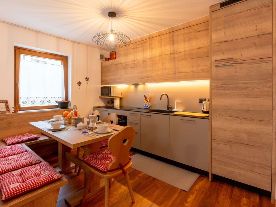 Cabinetry, Furniture, Countertop, Table, Kitchen, Wood, Lighting, Interior Design, Orange, Sink