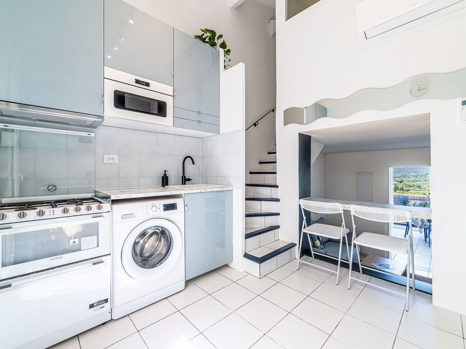 Property, Cabinetry, Laundry Room, Washing Machine, Building, Clothes Dryer, Interior Design, Lighting, Kitchen, Architecture