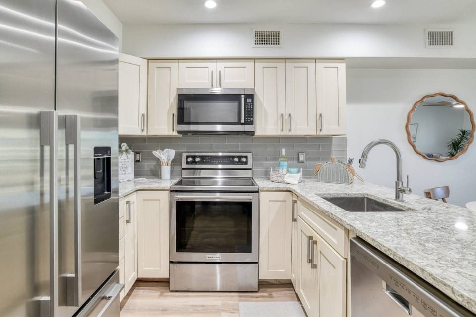 The kitchen features modern appliances and is stocked with everything you need to prepare your favorite foods and drinks.