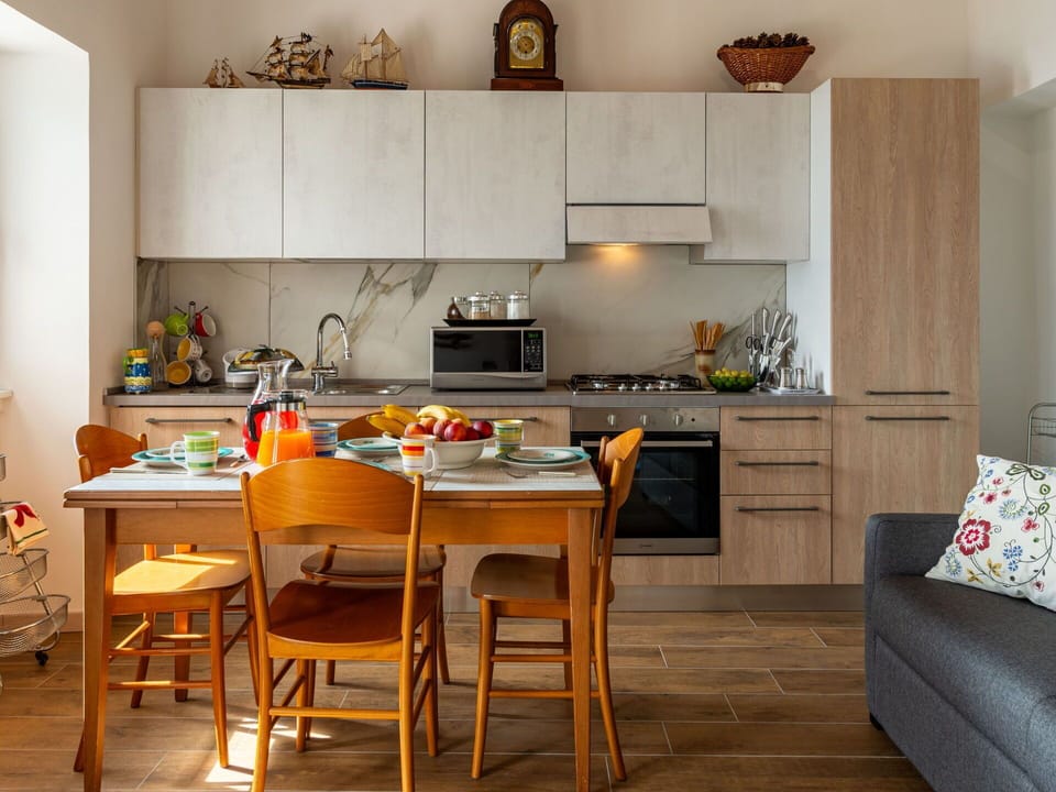 Furniture, Table, Cabinetry, Countertop, Wood, Orange, Chair, Interior Design, Kitchen, Flooring