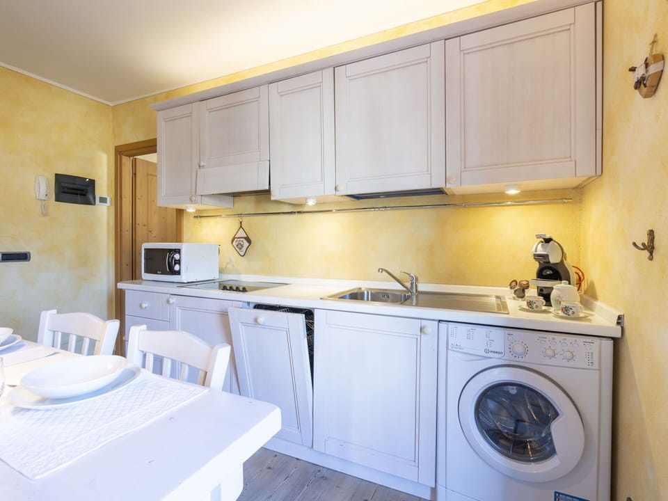 Interior Design, Flooring, Major Appliance, Floor, Furniture, Countertop, Kitchen, Kitchen Appliance, Room, Lighting