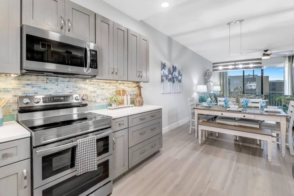 The beautifully remodeled kitchen is fully equipped with double ovens, microwave, dishwasher and refrigerator/freezer.