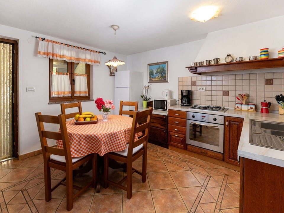 Property, Furniture, Cabinetry, Table, Countertop, Wood, Chair, Kitchen Stove, Kitchen Appliance, Interior Design