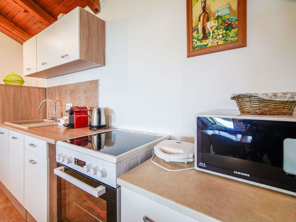 Wood, Major Appliance, Interior Design, Furniture, Flooring, Kitchen, Floor, Countertop, Ceiling, Wood Stain