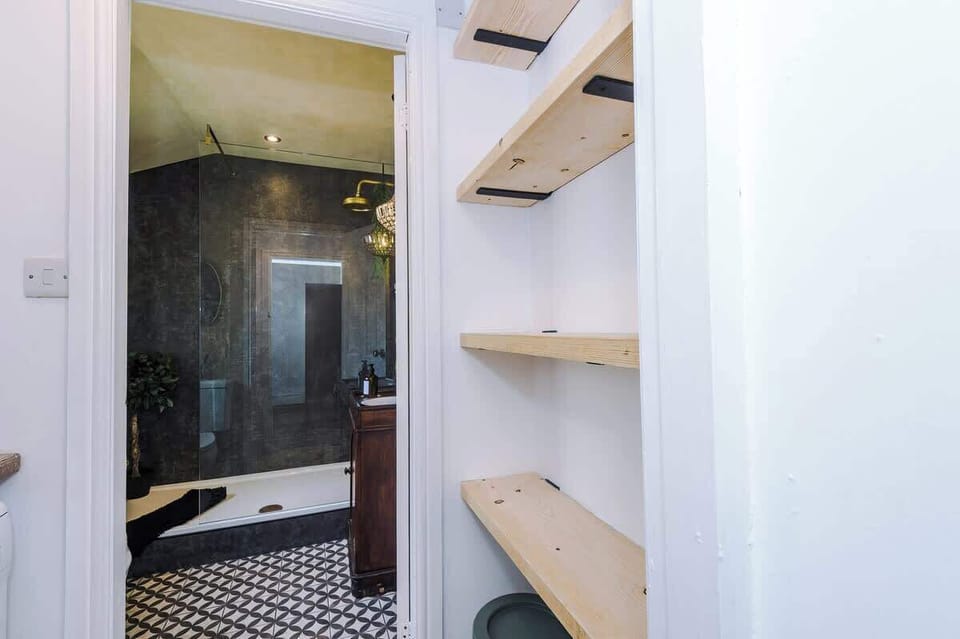 Fully equipped kitchen. Stylish, modern space featuring a farmhouse sink, wooden countertops, and all the essentials for your stay.